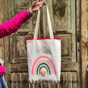 کیف توت بگ طرح رنگین کمان صورتی و قلب صورتی کم‌رنگ