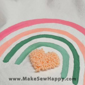 کیف توت بگ طرح رنگین کمان صورتی و قلب صورتی کم‌رنگ