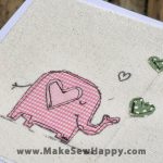 کارت پستال پارچه‌ای طرح فیل صورتی با قلب‌های سبز