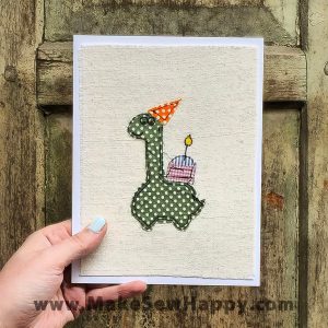 کارت پستال پارچه‌ای طرح کیک تولد و دایناسور سبز