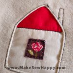 دستگیره آشپزخانه پارچه‌ای مدل خانه طرح گل رز رنگ سفید