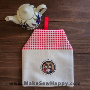 دستگیره آشپزخانه پارچه‌ای مدل خانه طرح دو آدمک