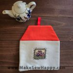 دستگیره آشپزخانه پارچه‌ای مدل خانه طرح دو آدمک