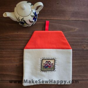 دستگیره آشپزخانه پارچه‌ای مدل خانه طرح دو آدمک