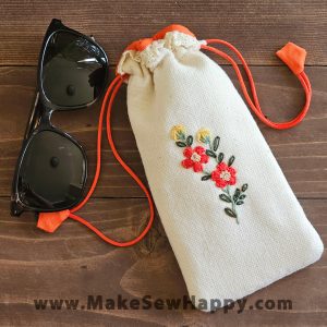 جا عینکی پارچه‌ای طرح گل‌دوزی نارنجی