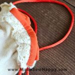 جا عینکی پارچه‌ای طرح گل‌دوزی نارنجی