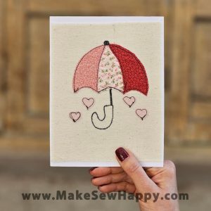 کارت پستال پارچه‌ای طرح چتر و قلب‌های صورتی